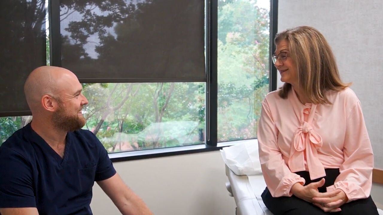 Image of PartnerMD patient talking with nurse in the exam room