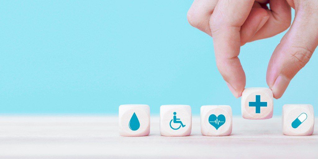 Dice with medical logos sitting on a table