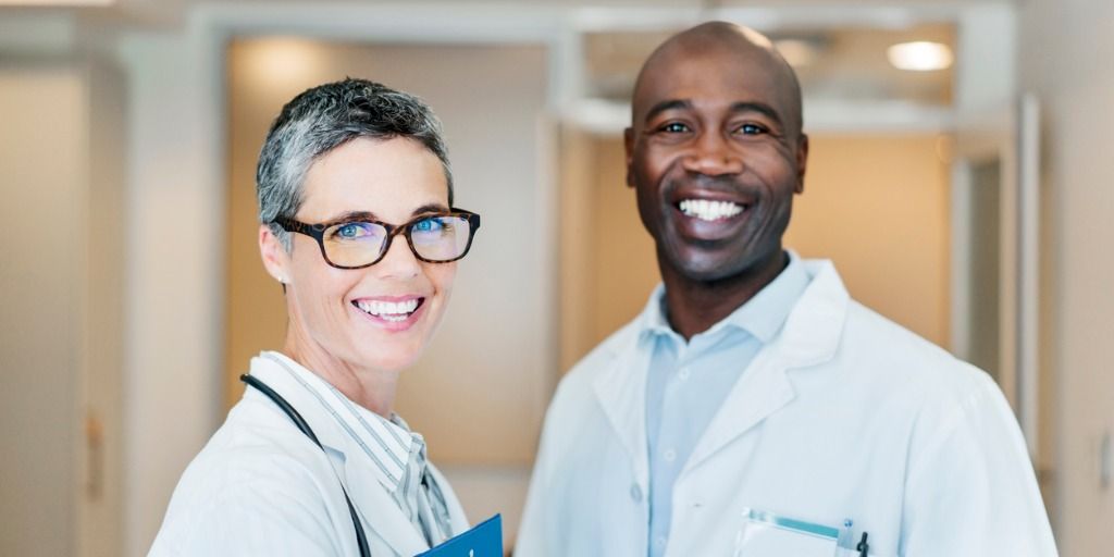 Two smiling concierge doctors