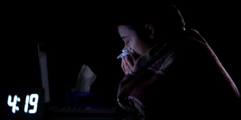 technical-support-female-worker-suffering-cold-and-sneezing-working-picture-id1183371939