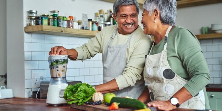 Elderly couple making a healthy meal 