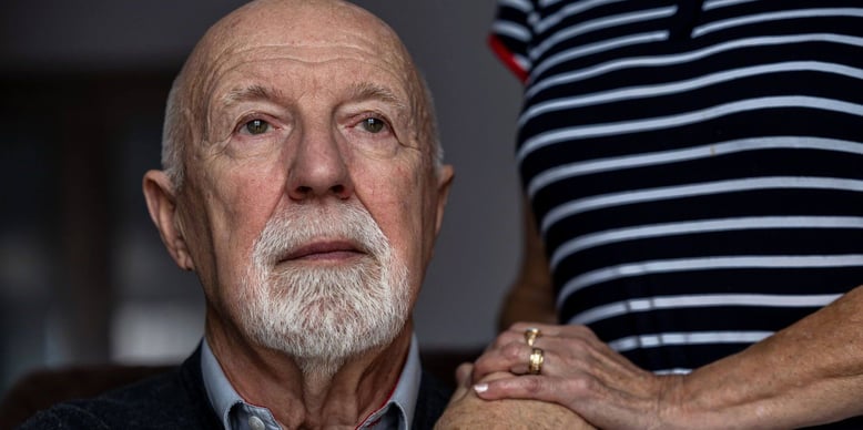 older man staring into the distance