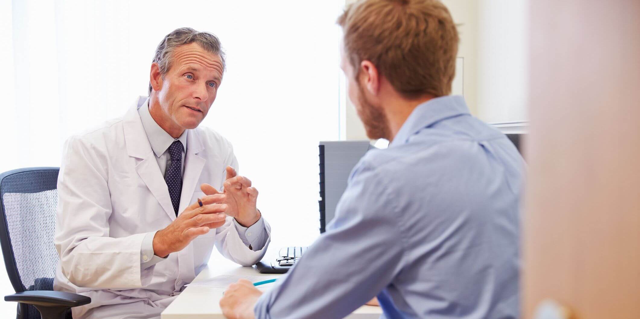 Physician talking to patient. 