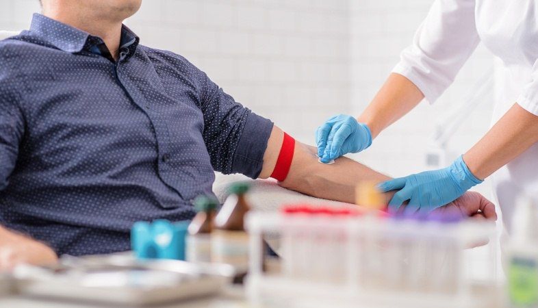 doctor preparing patient for lipid exam