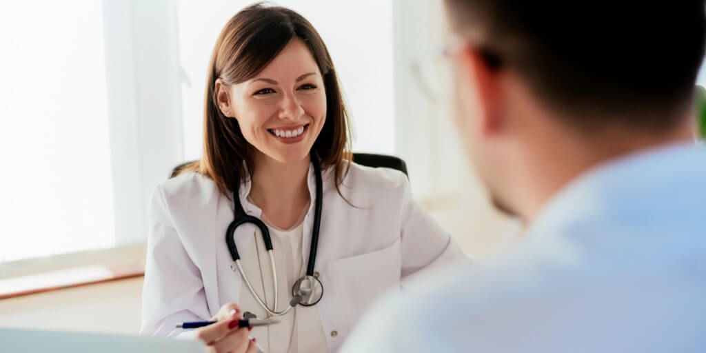 Concierge doctor talking with patient