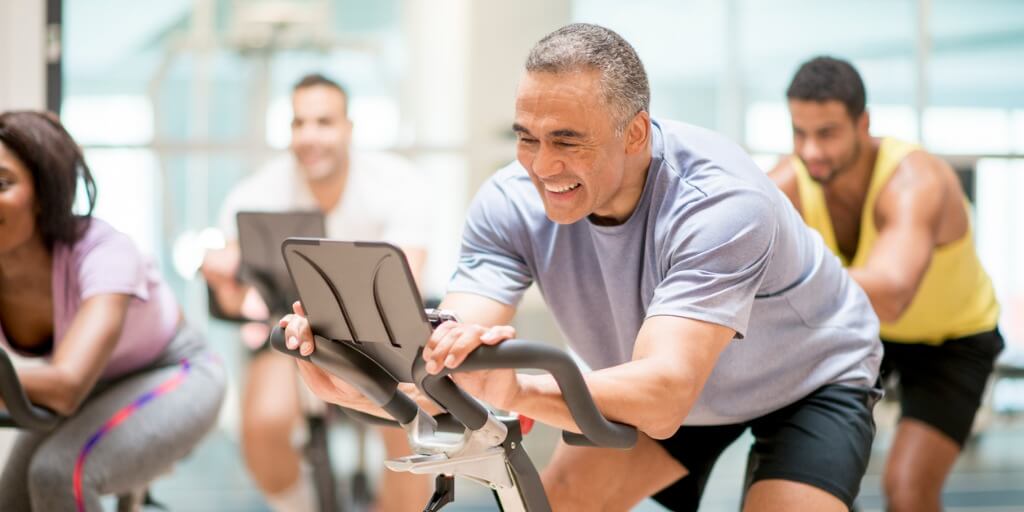 Man riding his exercise bike