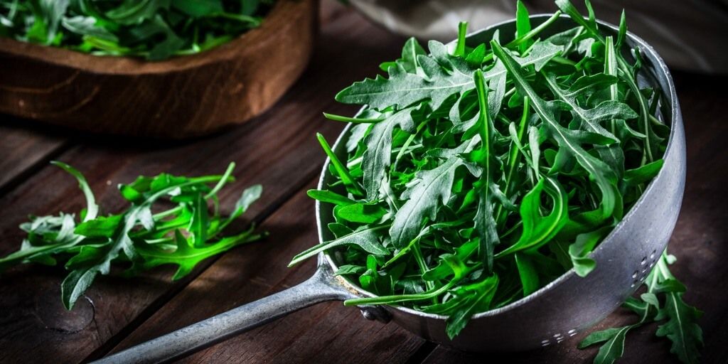 Arugula, a healthy spring vegetable, in a bowl