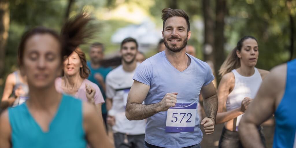 Young man smiling during a race