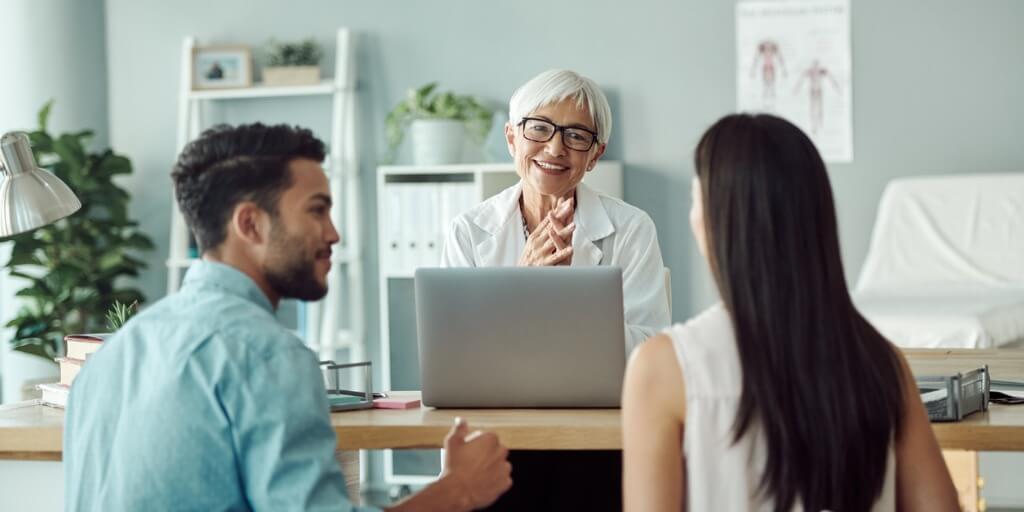 Two patients meeting with new primary care physician. 