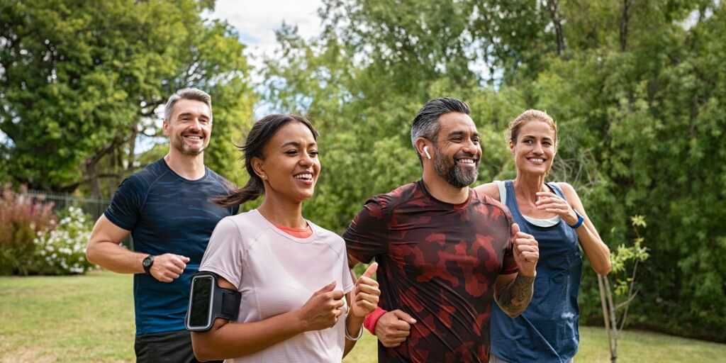 Group of adults exercising together in a park