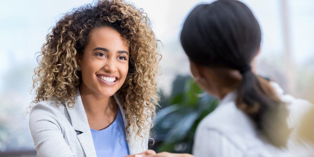 Patient happily meeting with a holistic primary care doctor in Northern Virginia