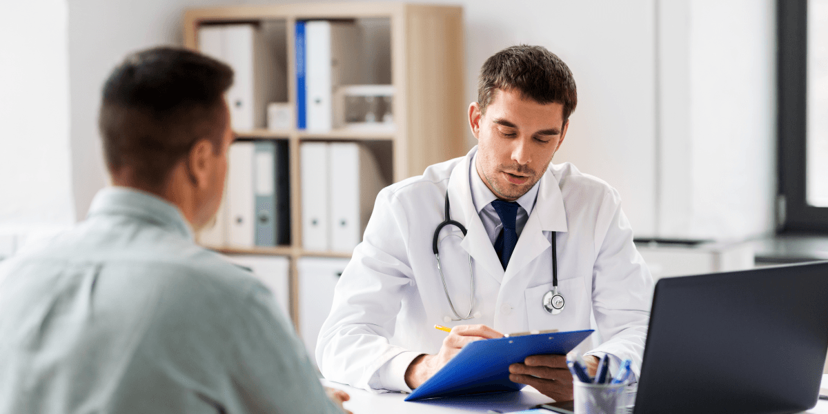 Man speaking with doctor