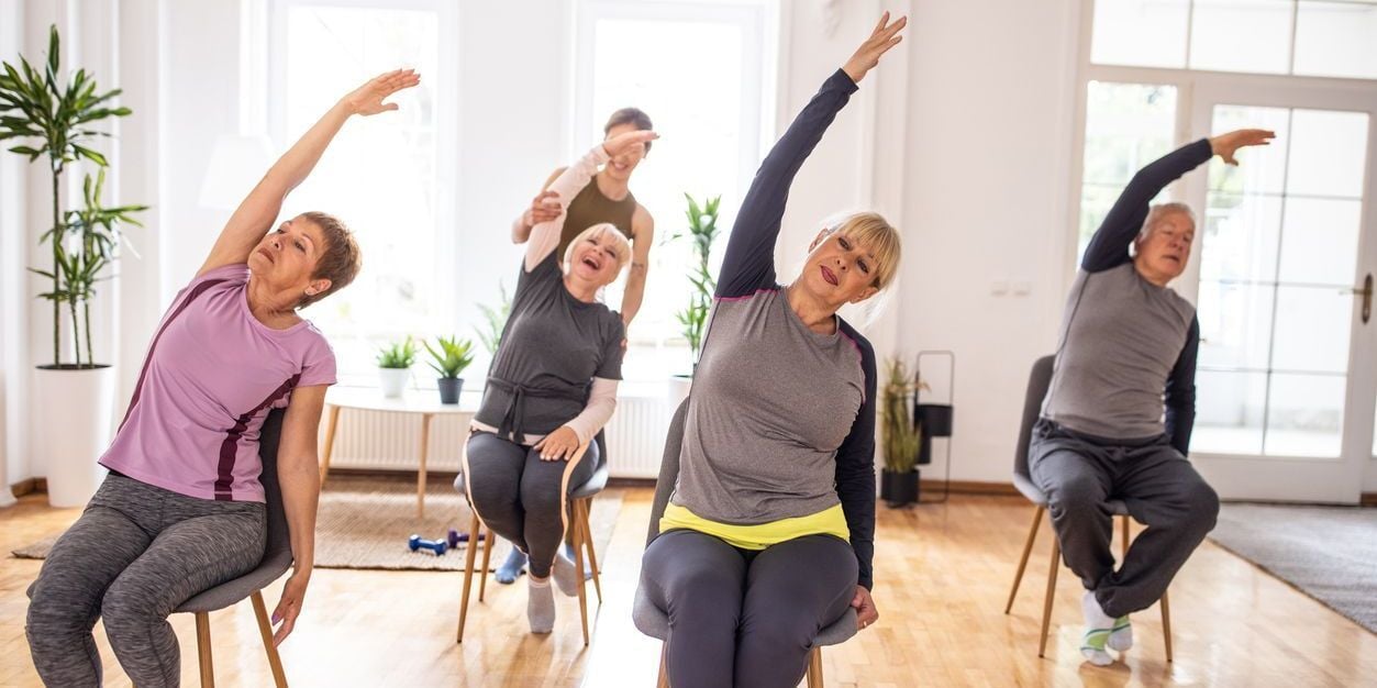 Seniors doing chair exercises. 