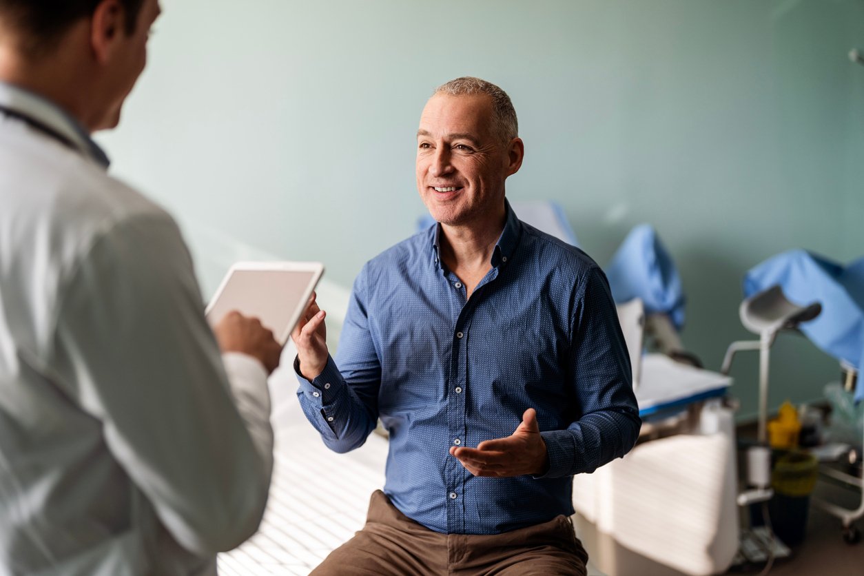 Doctor speaking to business exectutive