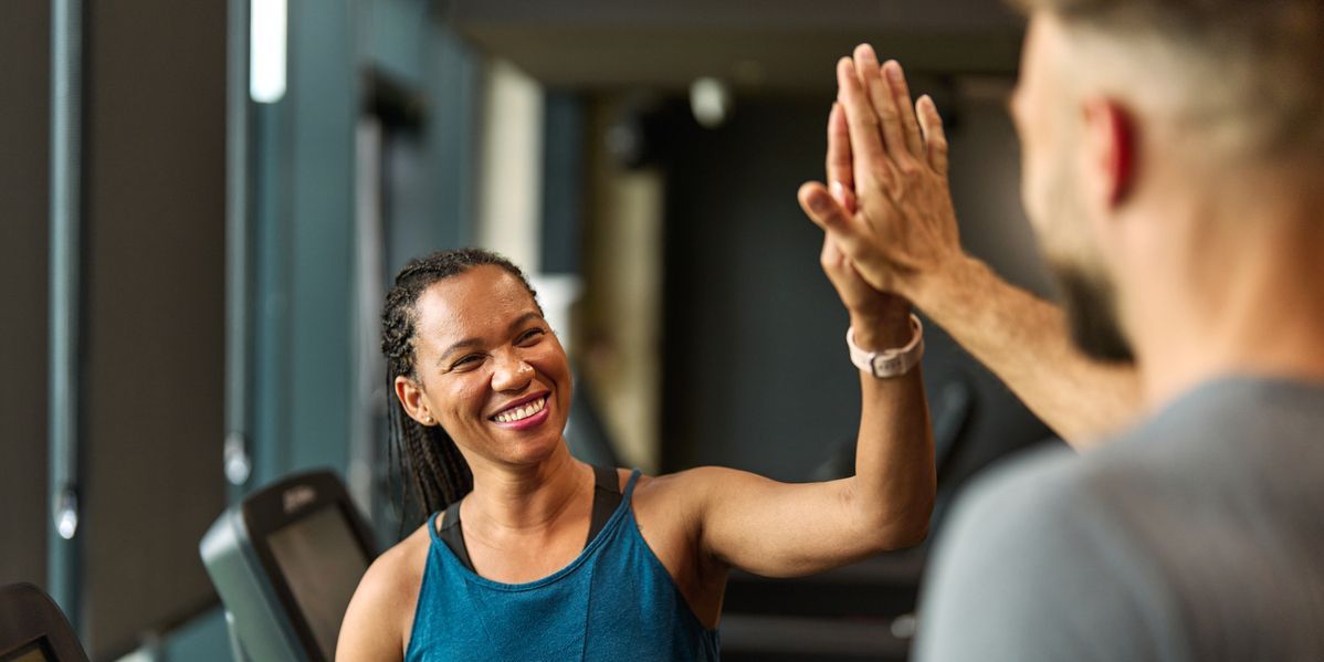 Coach high-fiving patient